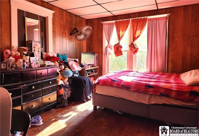 296 Falconer St, Jamestown, NY 14701 - bedroom featuring wood walls and wood finished floors