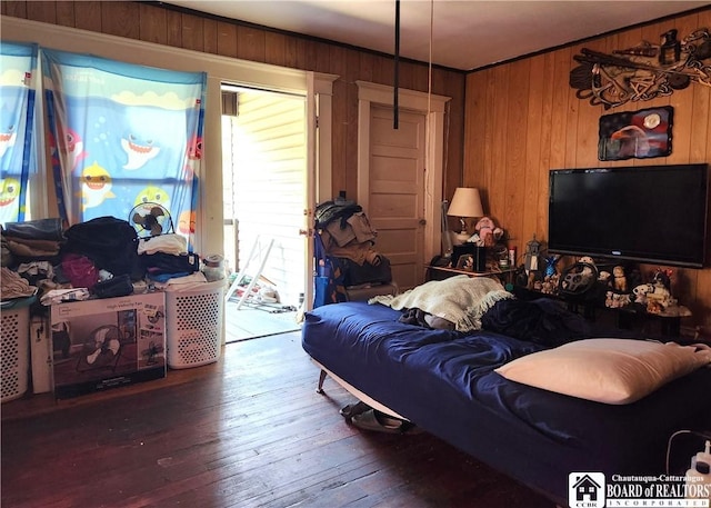 296 Falconer St, Jamestown, NY 14701 - living area with wooden walls, wood-type flooring, and ornamental molding