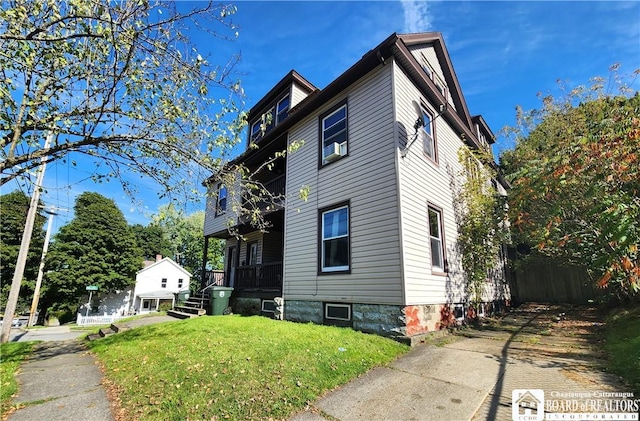 296 Falconer St, Jamestown, NY 14701 - view of home's exterior with a yard and a balcony