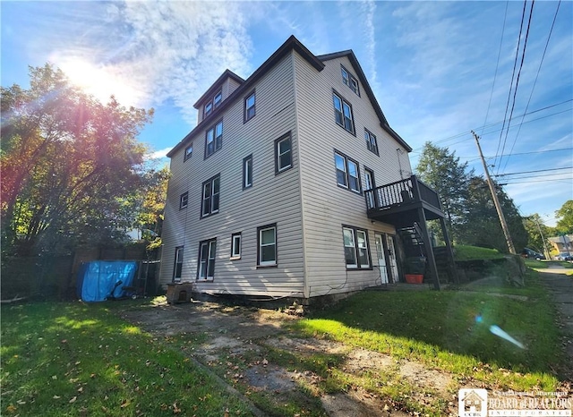 296 Falconer St, Jamestown, NY 14701 - view of side of home featuring a lawn and a deck