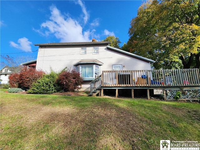 124 Bowen St, Jamestown, NY 14701 - back of property featuring a yard and a wooden deck