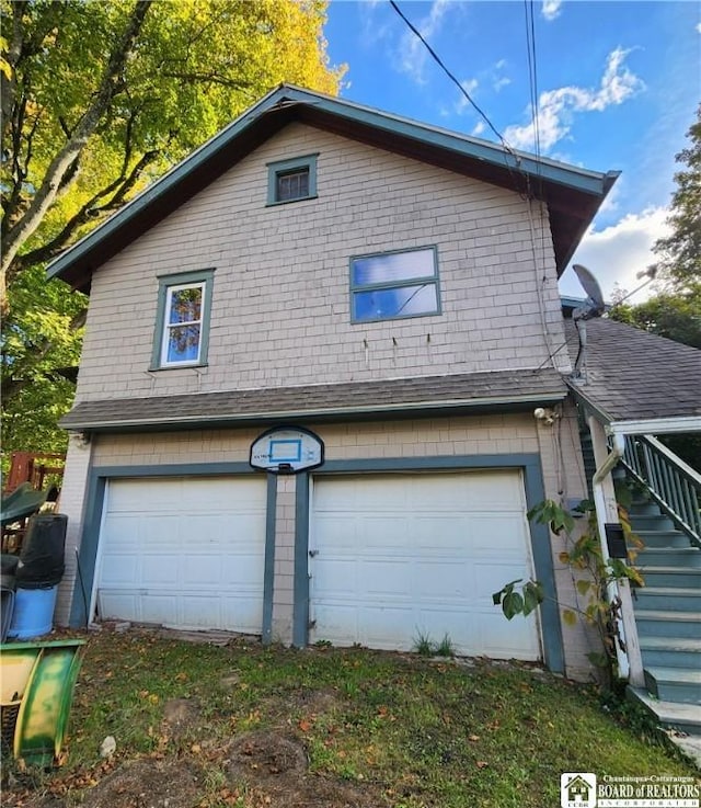 124 Bowen St, Jamestown, NY 14701 - view of side of home featuring a garage