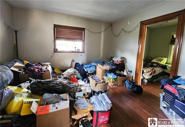 124 Bowen St, Jamestown, NY 14701 - bedroom with wood finished floors and a textured ceiling