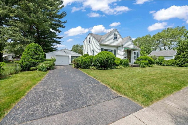334 Woodcrest Rd, Greece, NY 14616 - view of front of home with an outbuilding, a detached garage, and a front yard