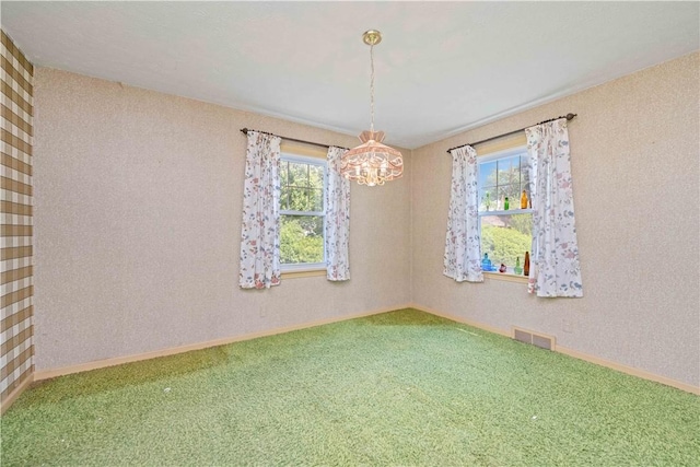 334 Woodcrest Rd, Greece, NY 14616 - carpeted spare room with healthy amount of natural light and a chandelier