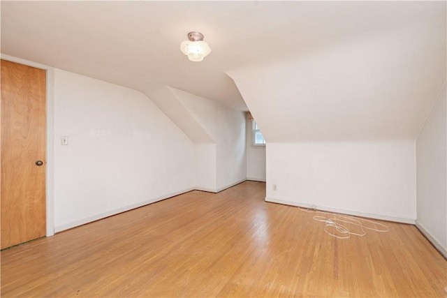 334 Woodcrest Rd, Greece, NY 14616 - additional living space with wood finished floors and vaulted ceiling