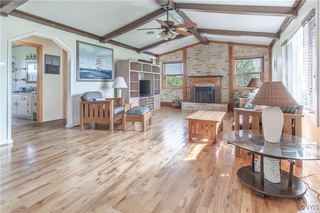 23214 County Route 59, Brownville, NY 13634 - living area featuring a fireplace, a ceiling fan, and light wood finished floors
