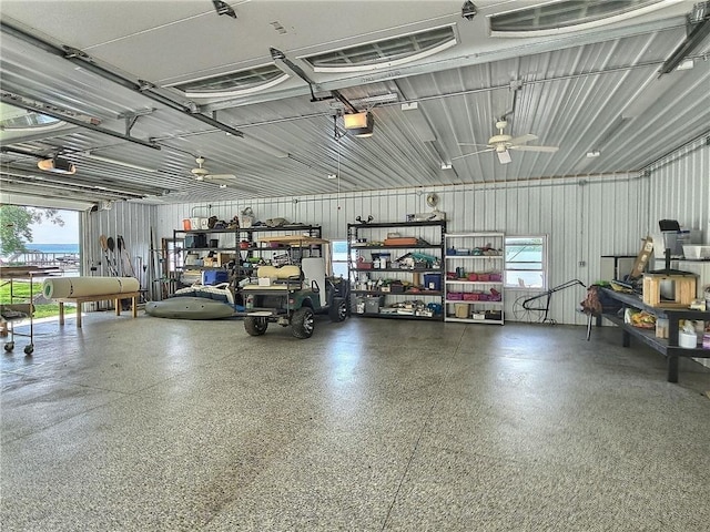 641 Fire Ln Unit 5, Genoa, NY 13081 - garage featuring a garage door opener and a ceiling fan