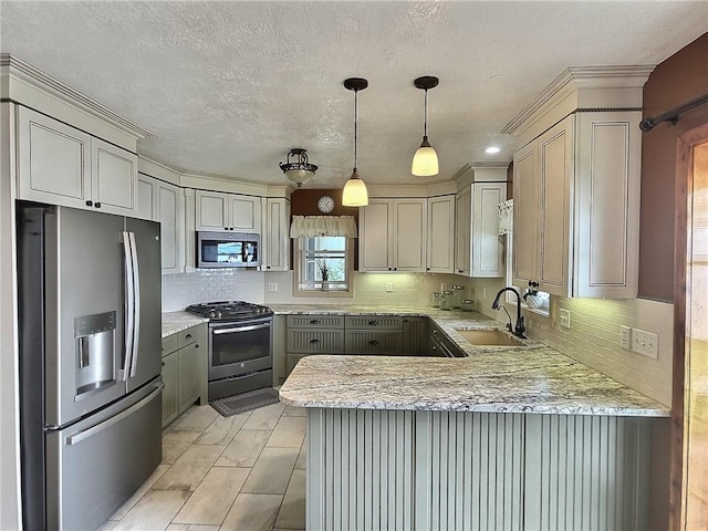 641 Fire Ln Unit 5, Genoa, NY 13081 - kitchen with appliances with stainless steel finishes, a peninsula, hanging light fixtures, tasteful backsplash, and light stone countertops