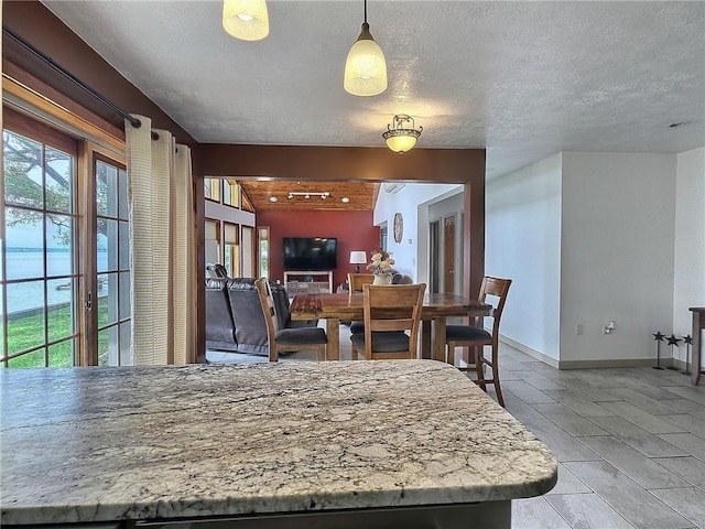 641 Fire Ln Unit 5, Genoa, NY 13081 - dining space with light tile patterned floors and a textured ceiling