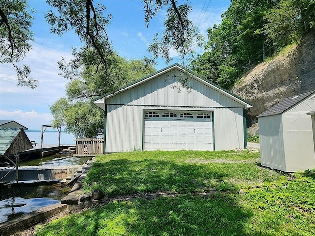 641 Fire Ln Unit 5, Genoa, NY 13081 - detached garage featuring a shed