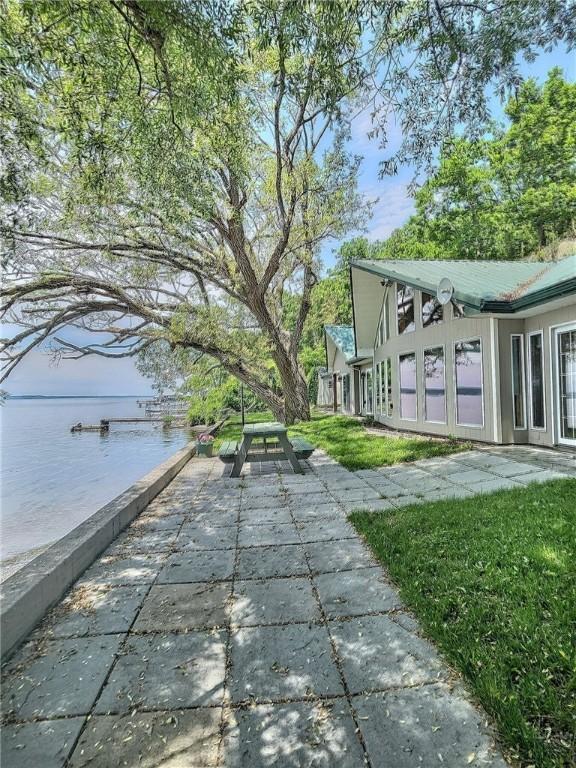641 Fire Ln Unit 5, Genoa, NY 13081 - view of patio featuring a water view