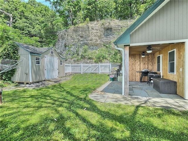 641 Fire Ln Unit 5, Genoa, NY 13081 - fenced backyard with a storage unit, ceiling fan, and a patio area