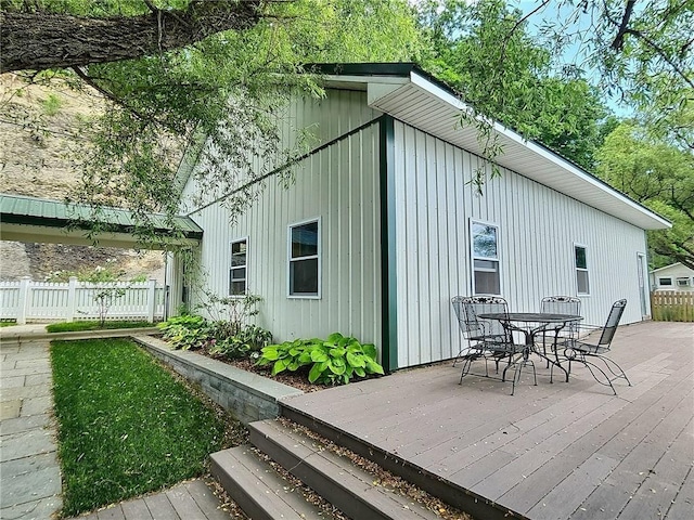 641 Fire Ln Unit 5, Genoa, NY 13081 - wooden terrace with outdoor dining area