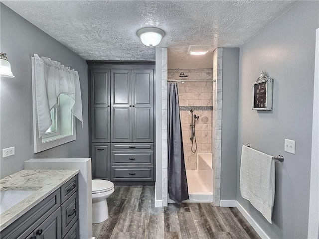 641 Fire Ln Unit 5, Genoa, NY 13081 - full bath featuring wood finished floors, vanity, and a textured ceiling