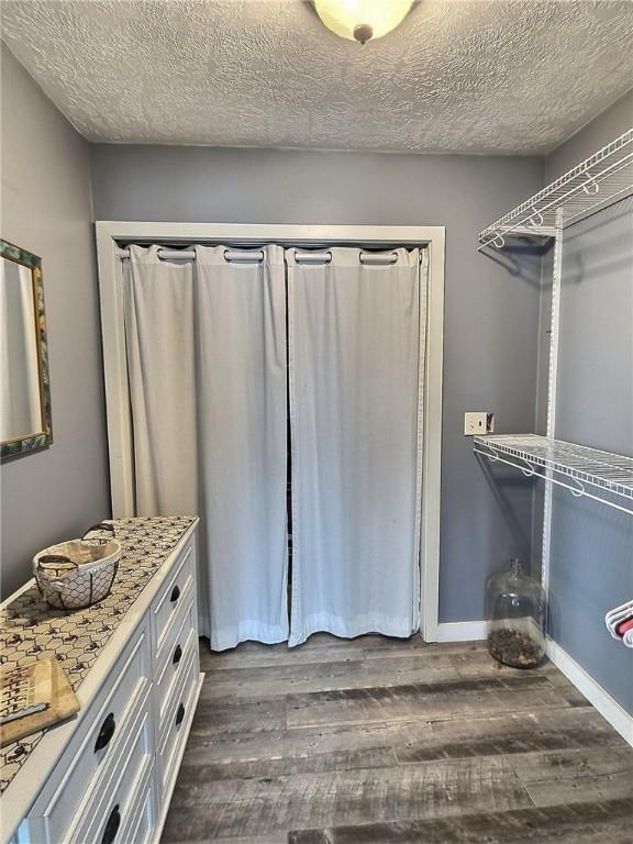 641 Fire Ln Unit 5, Genoa, NY 13081 - walk in closet featuring dark wood-style floors
