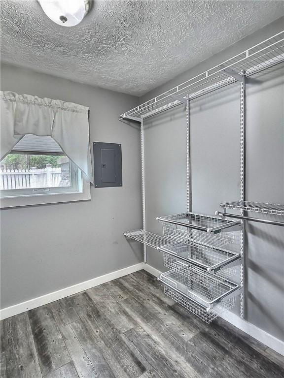 641 Fire Ln Unit 5, Genoa, NY 13081 - walk in closet with electric panel and wood finished floors
