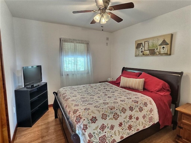 641 Fire Ln Unit 5, Genoa, NY 13081 - bedroom with wood finished floors and a ceiling fan