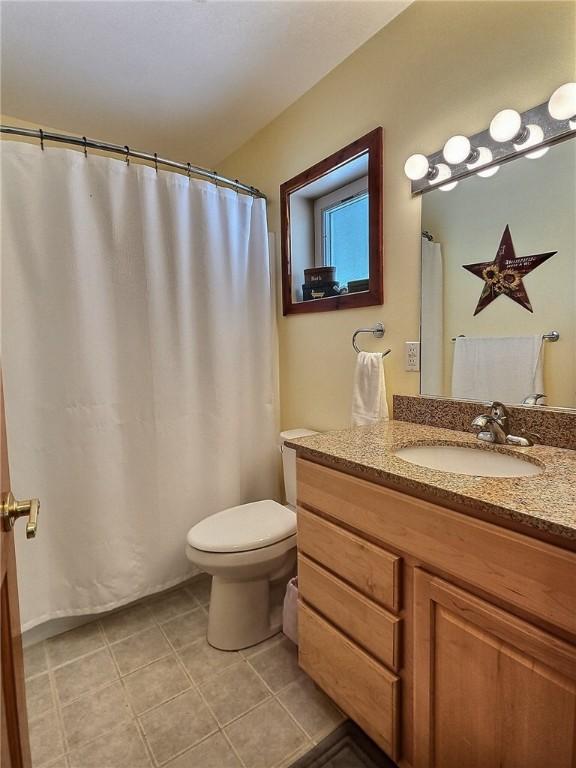 641 Fire Ln Unit 5, Genoa, NY 13081 - full bathroom featuring vanity and tile patterned flooring