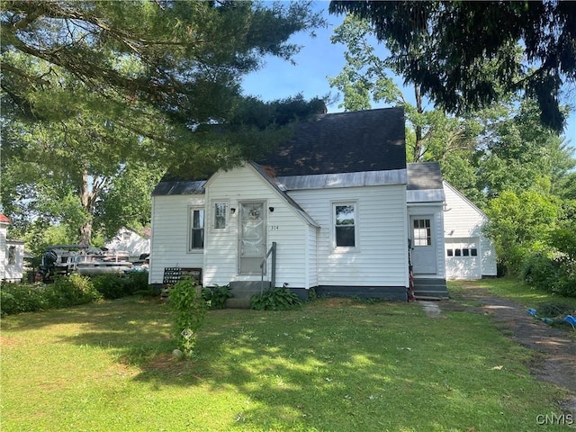 314 Mcrae St, Rome-Inside, NY 13440 - bungalow-style house featuring entry steps, a garage, and a front yard