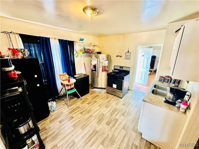 58 Olcott Pl, Cheektowaga, NY 14225 - kitchen featuring stainless steel appliances, light wood-style flooring, and light countertops