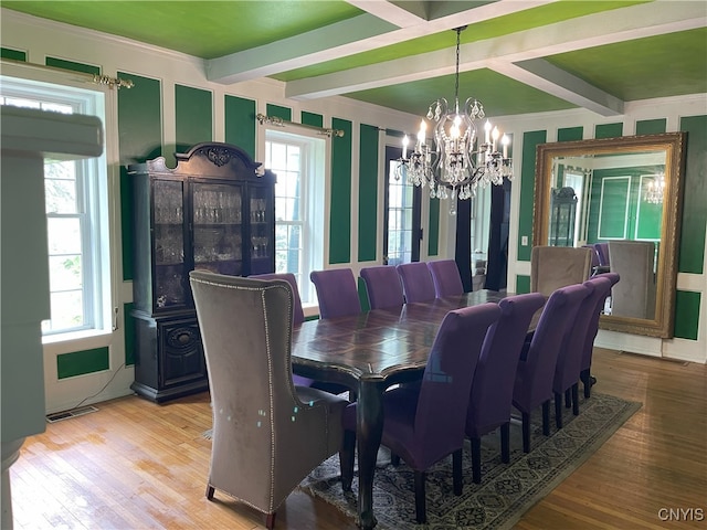 11159 State Route 34, Cato, NY 13033 - dining space with a chandelier, wood finished floors, beamed ceiling, and crown molding