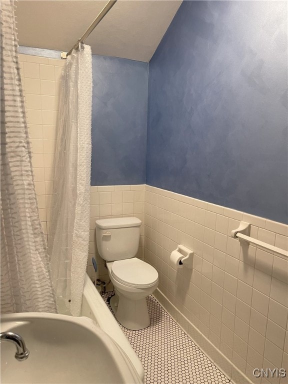 11159 State Route 34, Cato, NY 13033 - full bath featuring tile walls, tile patterned floors, and a wainscoted wall