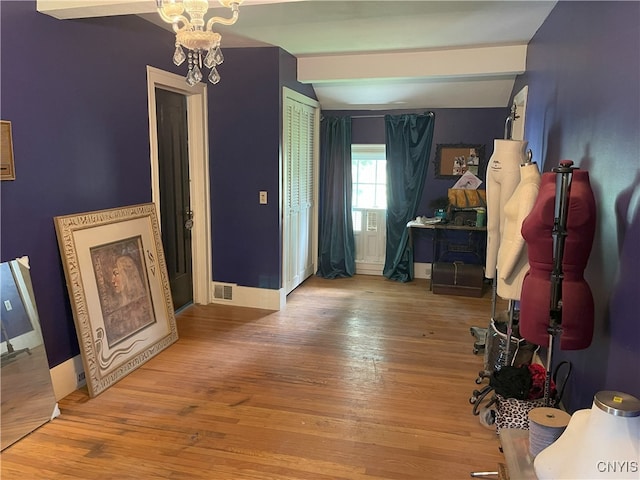 11159 State Route 34, Cato, NY 13033 - entrance foyer with vaulted ceiling, wood finished floors, and a chandelier