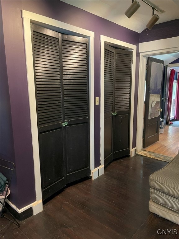 11159 State Route 34, Cato, NY 13033 - bedroom featuring track lighting, two closets, and wood-type flooring