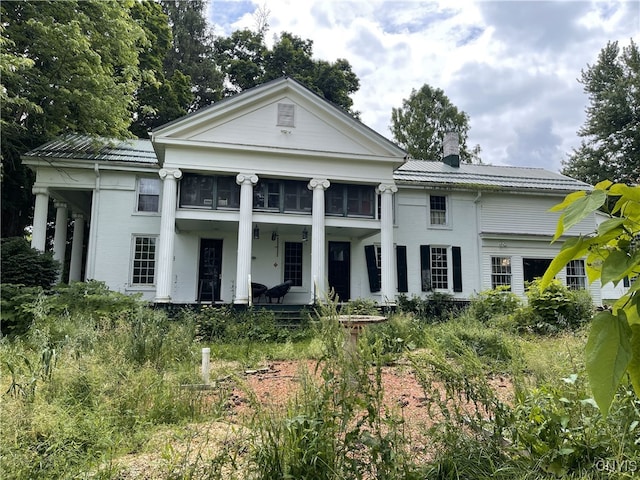 11159 State Route 34, Cato, NY 13033 - neoclassical / greek revival house featuring covered porch, a chimney, and a metal roof