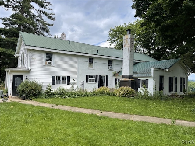 11159 State Route 34, Cato, NY 13033 - back of house featuring a chimney, a yard, and a metal roof