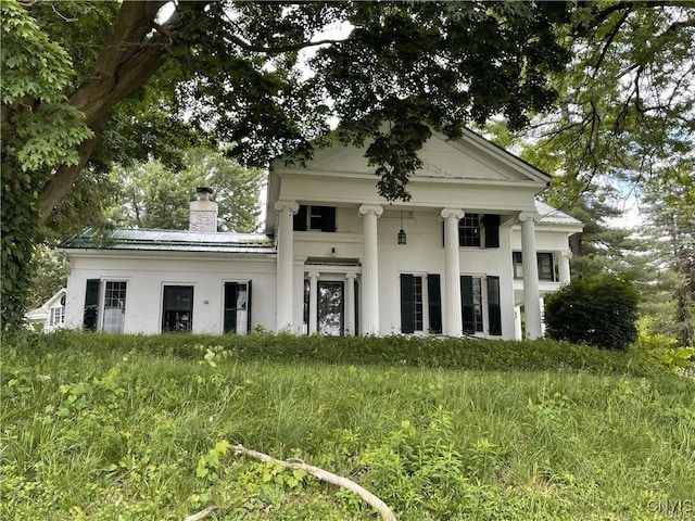 11159 State Route 34, Cato, NY 13033 - neoclassical / greek revival house featuring a chimney and stucco siding