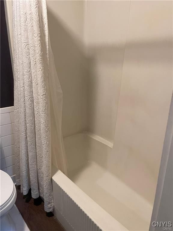 11159 State Route 34, Cato, NY 13033 - bathroom with shower / bath combo with shower curtain and tile walls