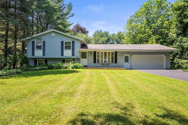 181 Widger Rd, Ogden, NY 14559 - tri-level home with asphalt driveway, a garage, and a front yard