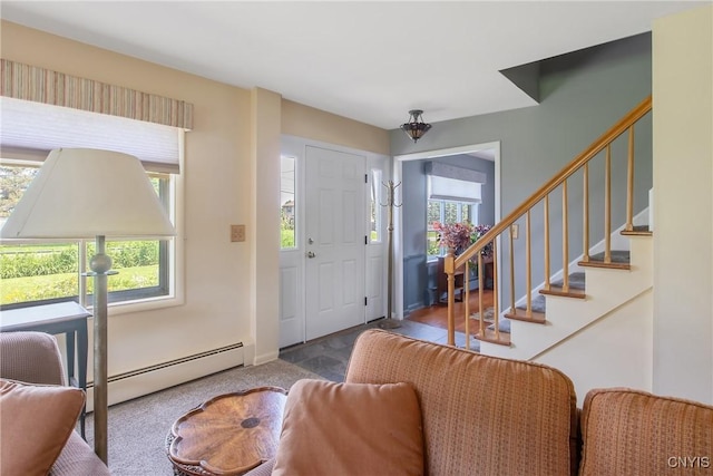 4853 Enders Rd, Manlius, NY 13104 - carpeted entrance foyer featuring a baseboard heating unit, plenty of natural light, and stairs