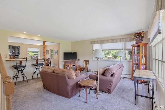 4853 Enders Rd, Manlius, NY 13104 - carpeted living area featuring a baseboard heating unit and ornate columns