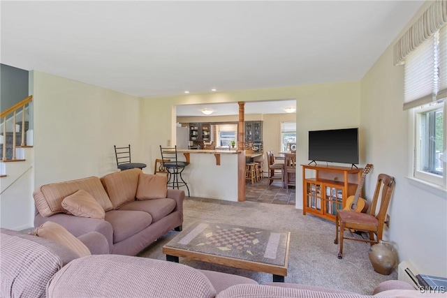 4853 Enders Rd, Manlius, NY 13104 - living room featuring stairs, light carpet, a baseboard heating unit, and recessed lighting