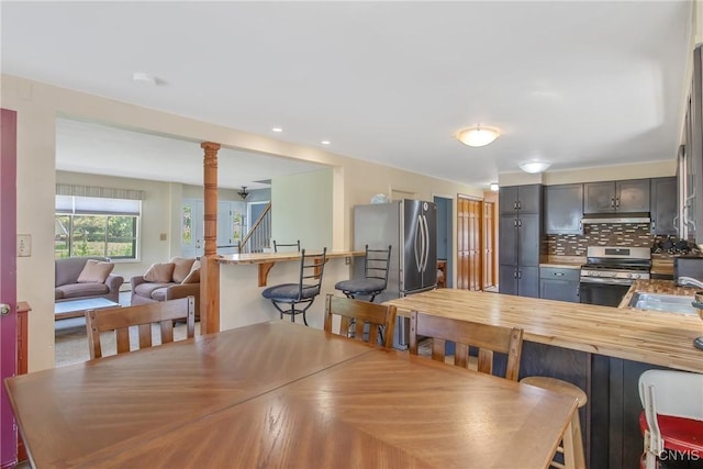 4853 Enders Rd, Manlius, NY 13104 - dining room with stairs and recessed lighting