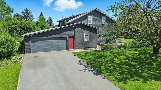 4853 Enders Rd, Manlius, NY 13104 - view of front of property with asphalt driveway, a front yard, and an attached garage