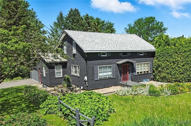 4853 Enders Rd, Manlius, NY 13104 - view of front of property with a shingled roof, a front yard, a garage, and asphalt driveway