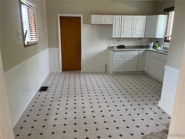 50 Ideal St, Buffalo, NY 14206 - kitchen with wainscoting and light countertops