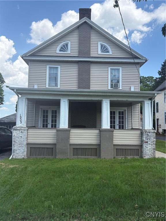 1905 S Geddes St, Syracuse, NY 13207 - view of front of house featuring covered porch, a chimney, and a front lawn