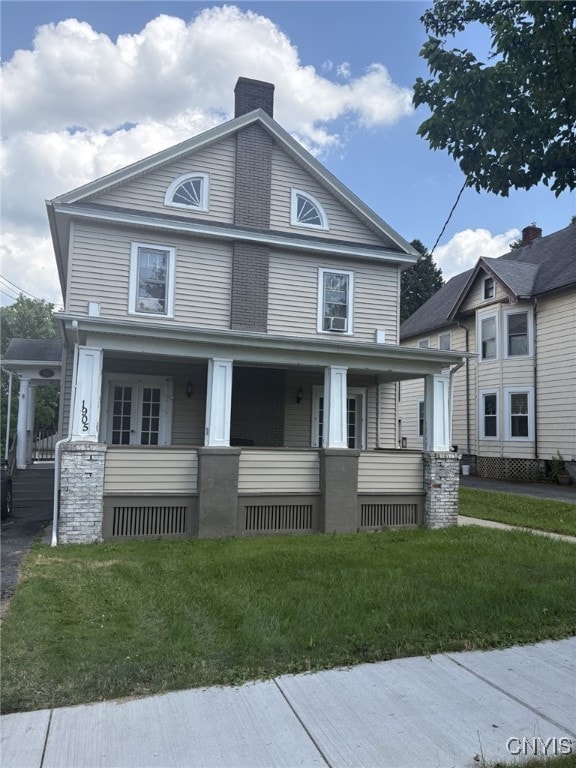 1905 S Geddes St, Syracuse, NY 13207 - view of front facade with covered porch, a chimney, and a front yard