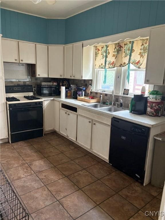 1905 S Geddes St, Syracuse, NY 13207 - kitchen with black appliances, backsplash, light countertops, and white cabinets