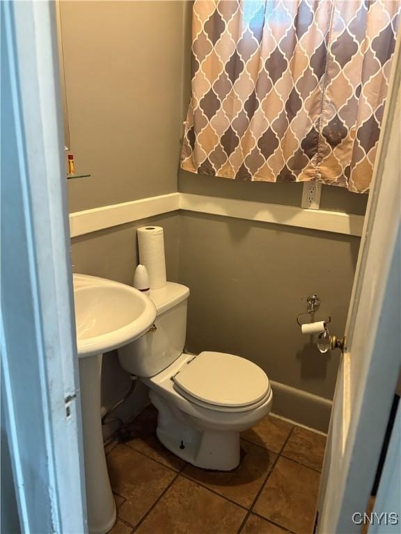 1905 S Geddes St, Syracuse, NY 13207 - bathroom with toilet and tile patterned floors