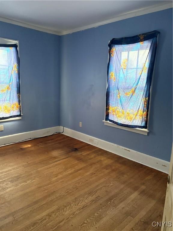 1905 S Geddes St, Syracuse, NY 13207 - unfurnished room with wood finished floors and ornamental molding