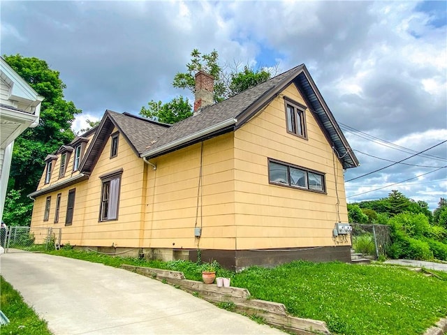 866 Smith St, Rochester, NY 14606 - view of property exterior featuring a chimney and a shingled roof