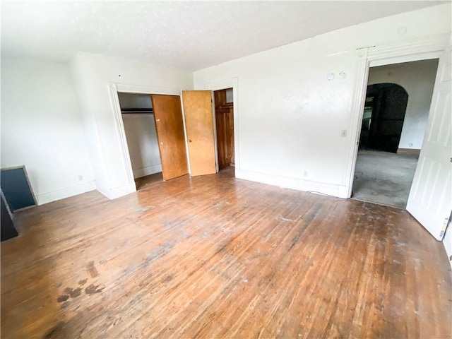866 Smith St, Rochester, NY 14606 - unfurnished bedroom featuring hardwood / wood-style floors and baseboards