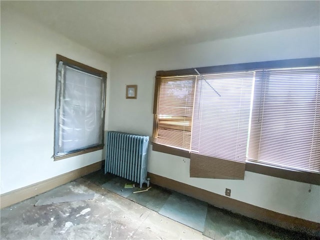 866 Smith St, Rochester, NY 14606 - empty room with radiator heating unit and baseboards