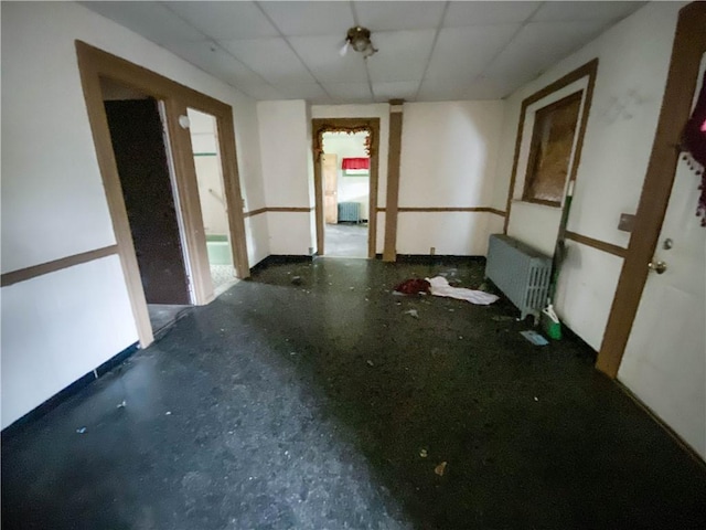 866 Smith St, Rochester, NY 14606 - empty room with radiator heating unit and a paneled ceiling